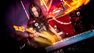 Emma Bell performs on bass during a performance with Vibrissæ