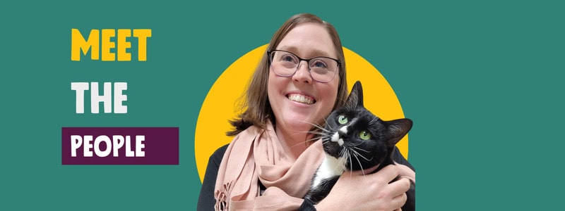 Teal background banner featuring a person holding a cat close to their face. Text on the right reads "Meet the People"